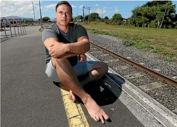  ?? SCOTT HAMMOND/ STUFF ?? Shane Colombus, whose toes were ‘‘chopped’’ off by a rusty train on a remote beach, is calling for authoritie­s to take action so no-one else gets hurt.