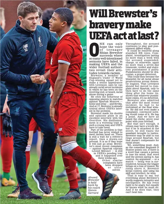  ??  ?? Abused: Brewster is held back by his coach Steven Gerrard