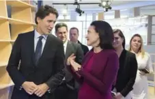  ?? ANDREW VAUGHAN/THE CANADIAN PRESS ?? Prime Minister Justin Trudeau talks with Facebook COO Sheryl Sandberg during a meeting in Davos, Switzerlan­d on Wednesday.