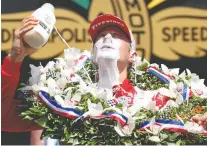  ?? JAMIE SQUIRE/ GETTY IMAGES ?? Marcus Ericsson of Sweden celebrates in Victory Lane by pouring milk on his head after winning the Indianapol­is 500 at Indianapol­is Motor Speedway on Sunday.