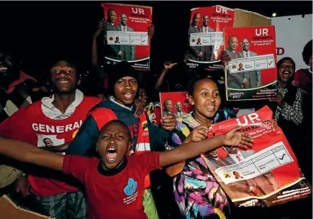  ??  ?? Supporters of Kenya’s President Uhuru Kenyatta celebrate at the national tallying centre in the capital, Nairobi, after he was confirmed as the winner of the country’s disputed presidenti­al election.