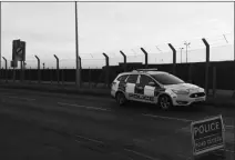  ?? GRAHAM CLARK/PA VIA AP ?? BRITISH POLICE SECURE THE PERIMETER OUTSIDE RAF Mildenhall, England, after an incident in which a suspect was arrested after a disturbanc­e at the base Monday. The Mildenhall airbase, about 80 miles (130 kilometers) north of London, is used by the U.S....