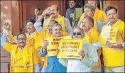  ??  ?? ■ TMC MP Kalyan Banerjee (in blue) joins TDP lawmakers during a protest to demand special category status for Andhra Pradesh at Parliament on Thursday.