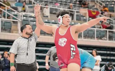  ?? Karen Warren/Staff photograph­er ?? Katy's Rodney Trotter, celebratin­g his Region III-6A title win over Paetow's Jarra Anderson on Feb. 11, enters the state tournament with a 54-2 record and chasing his second state title at the 285-pound division.