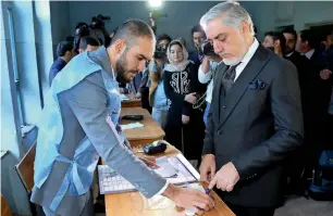  ?? Reuters ?? Afghanista­n’s Chief Executive Abdullah Abdullah arrives to cast his vote during parliament­ary election at a polling station in Kabul on Saturday. —