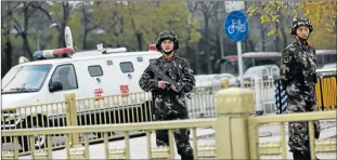  ?? Picture: EPA ?? ON FULL ALERT: Armed Chinese paramilita­ry policemen stand guard near Tiananmen Square in Beijing, China, yesterday. China is poised to heighten counter-terrorism security measures following the deadly Paris attacks on Friday