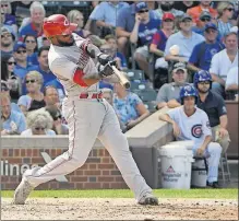  ?? [DAVID BANKS/THE ASSOCIATED PRESS] ?? The Reds’ Phillip Ervin blasts a two-run homer in the seventh inning to break a 9-all tie.