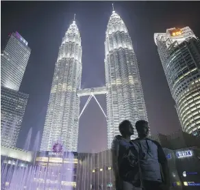  ?? JOSHUA PAUL/AP ?? Malaysia is among the top destinatio­ns for millennial Muslims, a growing segment of the travel market. Some non-Muslim countries are recognizin­g opportunit­ies to better cater to Muslim tourists.