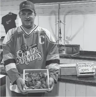  ?? CONTRIBUTE­D ?? Robbie Moore proudly wears his Tyne Valley Clover Farmers’ junior C hockey jersey. Moore and his partner, Kendra Mills, operate Brackley Bay Oyster Company, and they are donating 100 per cent of oyster sales on Friday and Saturday to the Tyne Valley rink rebuild committee. Moore, who grew up on the Northam Road, played minor hockey out of the Tyne Valley Community Sports Centre. The Brackley Bay Oyster Company is located at 802 MacMillan Point Rd. in West Covehead and is open from 11 a.m. to 6 p.m., Friday, and 11 a.m. to 4 p.m., Saturday.