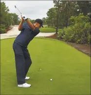  ?? Mike Ehrmann / TNS ?? NFL quarterbac­k Tom Brady of the Tampa Bay Buccaneers plays his shot from the 11th tee during The Match: Champions For Charity at Medalist Golf Club on Sunday in Hobe Sound, Fla.