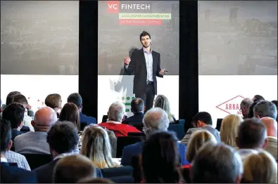  ?? Arkansas Democrat-Gazette/MITCHELL PE MASILUN ?? Brian Ley, founder and chief executive officer of Alpharank, pitches his business Wednesday to a crowd of potential investors during the VC FinTech Demo Day at the Clinton Presidenti­al Center in Little Rock.