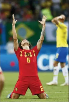  ?? MATTHIAS SCHRADER — THE ASSOCIATED PRESS ?? Belgium’s Axel Witsel, center, celebrates after the final whistle in Kazan, Russia on Friday. Belgium beat Brazil, 2-1.