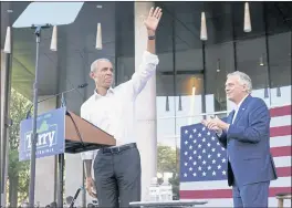  ?? STEVE HELBER — THE ASSOCIATED PRESS ?? Former President Barack Obama, left, waves during a rally with Democratic gubernator­ial candidate, former Virginia Gov. Terry McAuliffe in Richmond, Va., on Saturday.