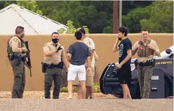  ?? ADOLPHE PIERRE-LOUIS/JOURNAL ?? Bernalillo County Sheriff’s Office deputies give instructio­ns to onlookers at the scene of an active shooter situation on Locust NE on May 31, 2020. The head of the union representi­ng BCSO deputies says the agency doesn’t have enough deputies on patrol.