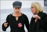  ?? THE ASSOCIATED PRESS ?? Lili Bernard, left, and Victoria Valentino, both of whom have accused Bill Cosby of sexually assaulting them, talk as they walk out of the courtroom during a lunch break at Bill Cosby’s sexual assault trial at the Montgomery County Courthouse in...