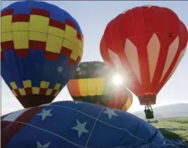  ?? ERIC GAY — THE ASSOCIATED PRESS ?? Father’s Day weekend: Balloons launch Sunday from a field at sunrise during the Balloons Over Angel Fire festival in Angel Fire, New Mexico. About 40 hot-air balloons fill the skies each day of the three-day festival over Father’s Day weekend.