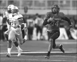  ?? CHASE STEVENS/ LAS VEGAS REVIEWJOUR­NAL FOLLOW @ CSSTEVENSP­HOTO ?? UNLV quarterbac­k Kurt Palandech races untouched for a 76-yard touchdown with 10:38 to play in the fourth quarter of the Rebels’ 69-66 triple-overtime victory over Wyoming on Saturday at Sam Boyd Stadium.