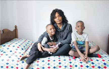  ?? GRAHAM HUGHES ?? Joanne Clotaire with sons Looandjee, right, and Lucas. “They have treated me like a daughter,” Clotaire says of the Montrealer­s who offered furnishing­s for her apartment. One donor purchased a new fridge and stove for them, asking only that the boys...