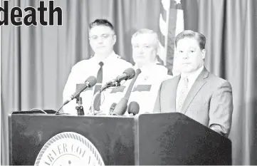  ??  ?? Attorney Metz speaks at a press conference announcing no criminal charges in the Fentanyl death of Prince while (left to right) Carver County Chief Deputy Jason Kamerud, Carver County Sheriff Jim Olson and Chief Deputy Carver County Attorney Peter Ivy...