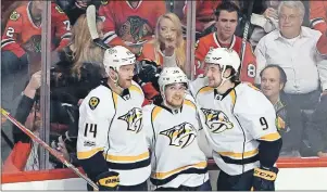  ?? AP PHOTO ?? In this April 13 file photo, Nashville Predators right wing Viktor Arvidsson (centre) celebrates his goal against the Chicago Blackhawks with defenseman Mattias Ekholm (left) and centre Filip Forsberg during Game 1 of a firstround NHL playoff series in...