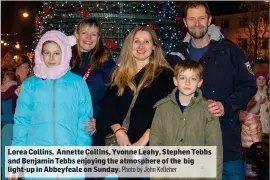  ?? Photo by John Kelleher ?? Lorea Collins, Annette Collins, Yvonne Leahy, Stephen Tebbs and Benjamin Tebbs enjoying the atmosphere of the big light-up in Abbeyfeale on Sunday.