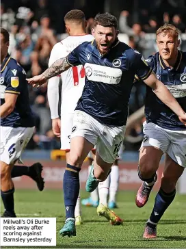  ?? ?? Millwall’s Oli Burke reels away after scoring against Barnsley yesterday