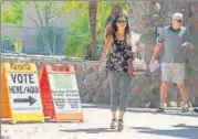  ?? AFP ?? Voters exit a polling booth in Phoenix, Arizona, on Tuesday.