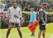  ?? Susan Stocker/TNS ?? Miami Dolphins cornerback Byron Jones, left, pictured rehabbing last June, tweeted Saturday about why he could never suit up in the 2022 season.