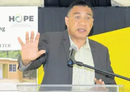  ?? ASHLEY ANGUIN/ PHOTOGRAPH­ER ?? Prime Minister Andrew Holness speaking at a handing over ceremony for a house constructe­d under the Government’s New Social Housing Programme in Latium, St James, yesterday.