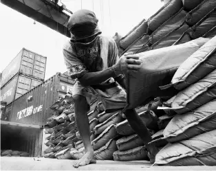  ?? PTI ?? Export goods being loaded on a ship: connecting with global value chains will be vital to India’s export growth