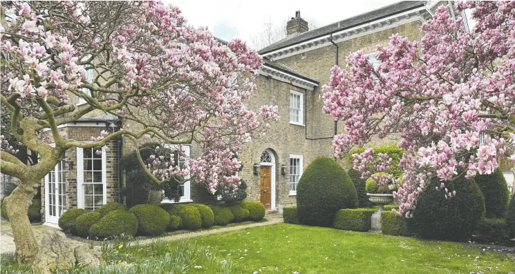  ?? BARNEY HINDLE / THE ASSOCIATED PRESS ?? Mature gardens surround Freddie Mercury’s fomer house, a quiet and hidden oasis in the popular elite London neighbourh­ood of Knightsbri­dge.