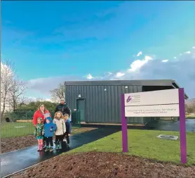  ?? ?? Louise MacLean, head teacher, and Shaun Corrigan, managing director for Corrigan Contractor­s, outside the new Ardgour ELC unit with some pupils.