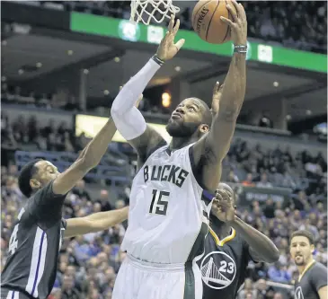  ?? AFP ?? The Bucks’ Greg Monroe goes for the hoop during the fourth quarter against the Warriors.