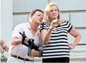  ?? LAURIE SKRIVAN/ST. LOUIS POST-DISPATCH ?? Mark and Patricia McCloskey face a felony charge for displaying guns during a racial injustice protest in June.