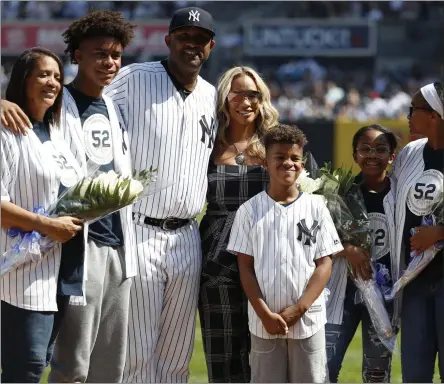  ?? MICHAEL OWENS - THE ASSOCIATED PRESS ?? New York Yankees’ CC Sabathia poses with his family as he his honored before a baseball game against the Toronto Blue Jays, Sunday, Sept. 22, 2019, in New York.