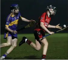  ??  ?? Jack C orrigan of Oulart-The Ballagh moving away from Joe Curtis.