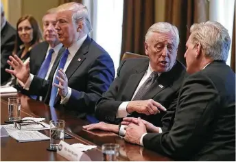  ?? Chip Somodevill­a / Getty Images ?? House Majority Leader Kevin McCarthy, right, and House Minority Whip Steny Hoyer debate Tuesday as President Donald Trump presides over a meeting about immigratio­n in the White House.