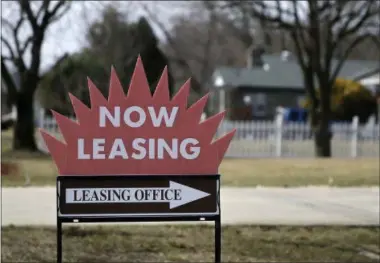  ?? MEL EVANS ?? This March 16 photo shows a “now leasing” sign outside an apartment complex near Millville, N.J. U.S. home rents jumped in July as house prices showed signs of flagging. Real estate data firm Zillow said Tuesday that rents rose a seasonally adjusted...