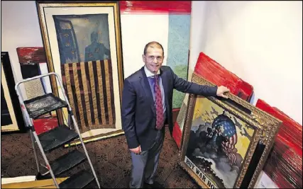  ?? HENRY TAYLOR / HENRY.TAYLOR@AJC.COM ?? Jeff Bridgman, 49, owner of Jeff R. Bridgman Antiques Inc., is the nation’s largest collector and dealer of antique American flags, and he’s bringing a portion of his collection to the 2017 Cathedral Antiques Show.