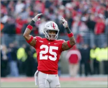  ?? JAY LAPRETE — THE ASSOCIATED PRESS ?? Ohio State defensive back Brendon White celebrates after making a tackle Saturday against Michigan.