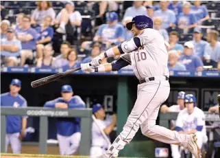  ??  ?? Houston Astros first baseman Yuli Gurriel hits a three run home run in the ninth inning against the Kansas City Royals at Kauffman Stadium on Monday night. (USA TODAY Sports)