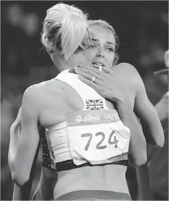  ?? DAVID J. PHILLIP/THE ASSOCIATED PRESS ?? Canada’s Melissa Bishop, right, embraces Britain’s Lynsey Sharp after placing fourth in the women’s 800-metre final at the Summer Olympics in Rio de Janeiro, Brazil, on Saturday.