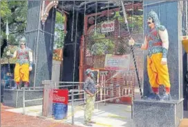  ?? ANI ?? A worker sanitizes Krishna Janmasthan temple premises amid the rise in Coronaviru­s cases, in Mathura on Tuesday.