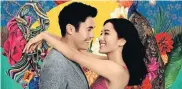  ??  ?? MONEY AND LOVE: Constance Wu and Henry Golding star in ‘Crazy Rich Asians’