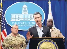  ?? RICH PEDRONCELL­IE/ASSOCIATED PRESS ?? California Gov. Gavin Newsom discusses his decision to withdraw several hundred National Guard troops from the nation’s southern border in Sacramento on Monday.