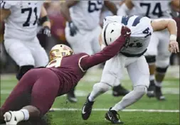  ?? Hannah Foslien/Getty Images ?? Minnesota’s Esezi Otomewo sacks Penn State’s Sean Clifford.