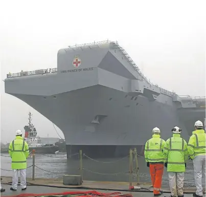  ??  ?? The vessel has been floated and moved to her fitting-out berth at Rosyth. Picture: PA.