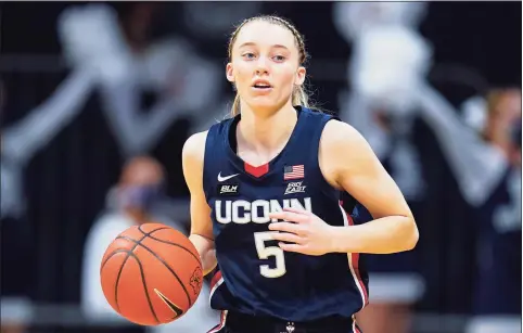  ?? Michael Conroy / Associated Press ?? UConn’s Paige Bueckers plays against Butler during the first quarter of a game in Indianapol­is on Feb. 27.