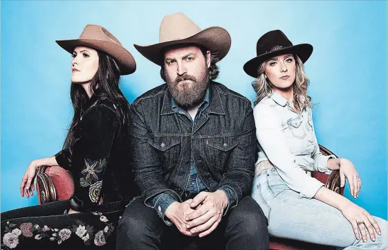  ?? JEN SQUIRES PHOTO ?? Hamilton’s Redhill Valleys, Chelsea McWilliams, left, Tim Allard and Danielle Beaudin, provide one of the standout tracks with “Love is a Long Road.”