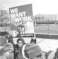  ??  ?? US federal government workers and other demonstrat­ors protest outside the White House during a‘Rally to End the Shutdown’ in Washington, US.With about a quarter of the federal workforce affected, the shutdown is currently squeezing an estimated US$1.2 billion a week out of the economy and that figure could grow if it drags on. — Reuters photo